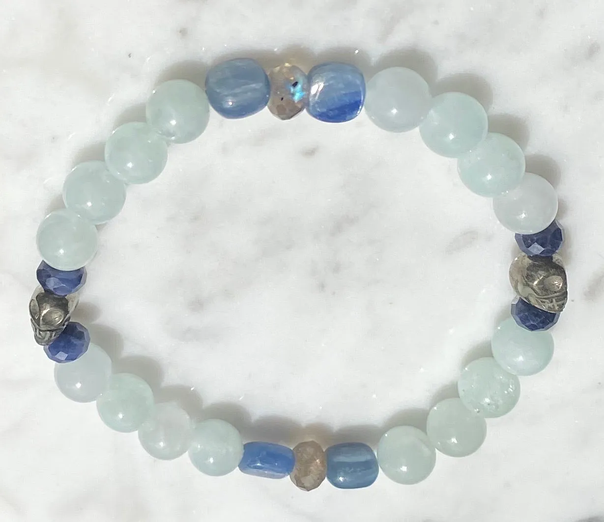 Aquamarine, labradorite, blue sapphires, pyrite skull, and kyanite gemstone bracelet